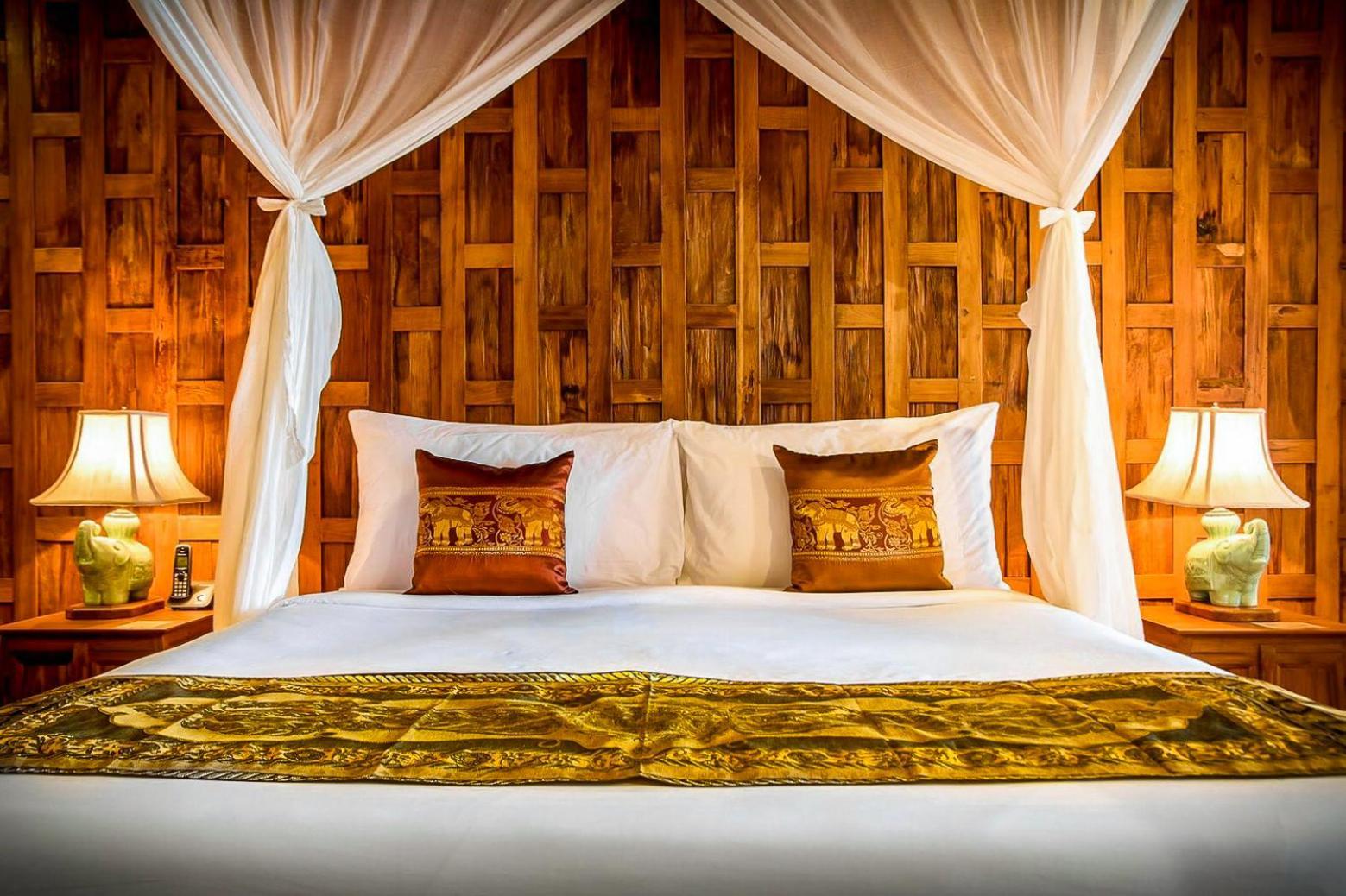Santhiya Koh Phangan Resort And Spa Exterior photo A bed with a mosquito net